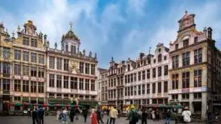 Tourists visiting vibrant plaza in Brussels, Belgium