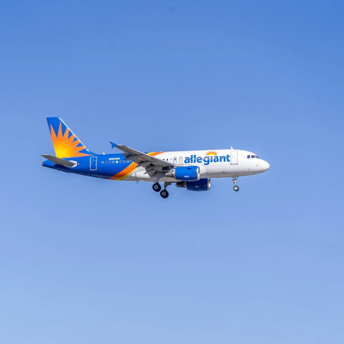 Allegiant Air plane flying in blue sky