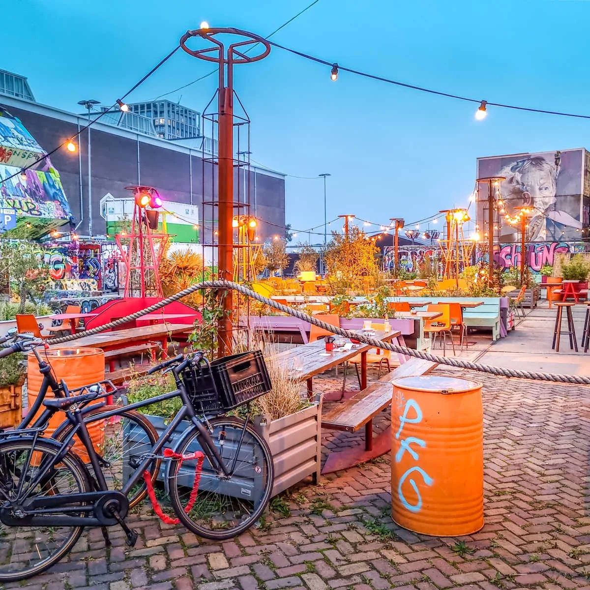 Amsterdam, Netherlands - Bicybles by a bar in the NDSM Amsterdam. The neighborhood is famous for its arts, restaurants and festivals.