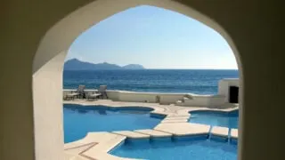 Window views of pool and sea from Manzillo resort