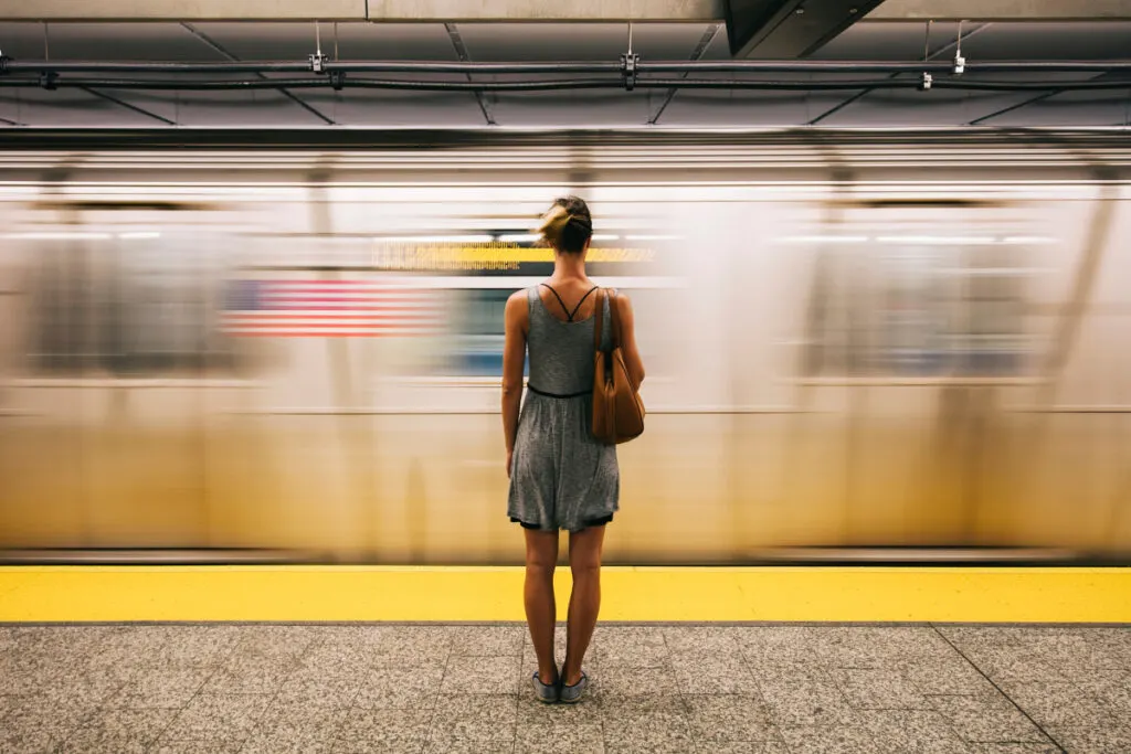 Woman in front of subway in New York