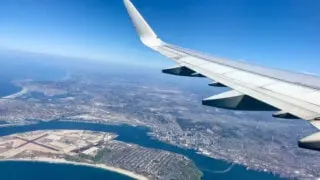 American Airlines plane flying over San Diego