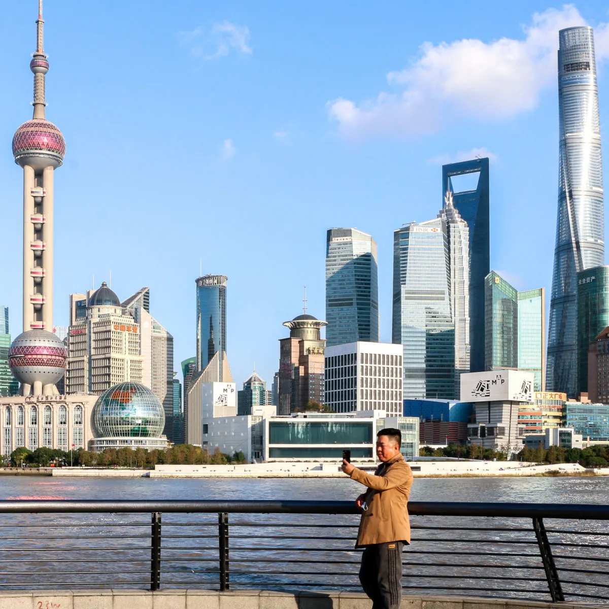Man taking selfie at Shanghai skyline