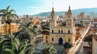 Bucamaranga cathedral backdropped by high-rises and mountains