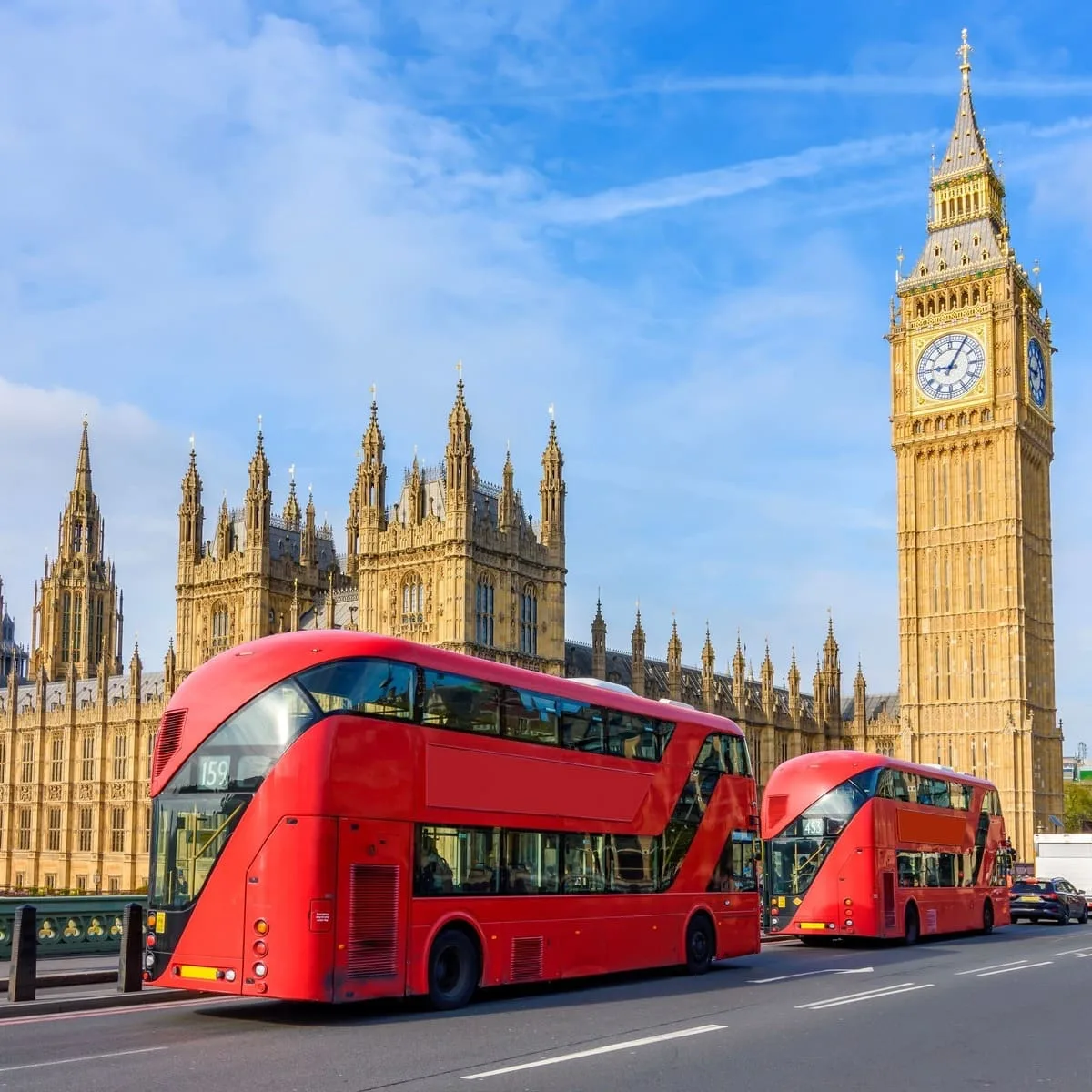 Red Bus Crossing Westminster Bridge With The Big Ben And The British Parliament Seen In The Background, London, United Kingdom