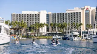 Jet skiers enjoying nice day outside Sheraton San Diego Hotel & Marina