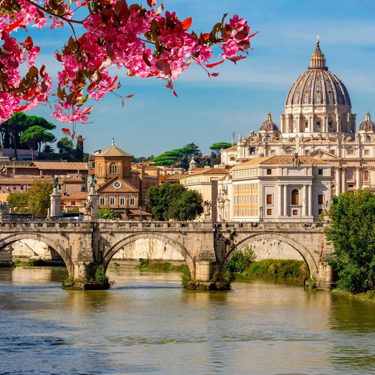 St Peter's basilica in Vatican and St. Angel bridge over Tiber river in spring, Rome, Italy