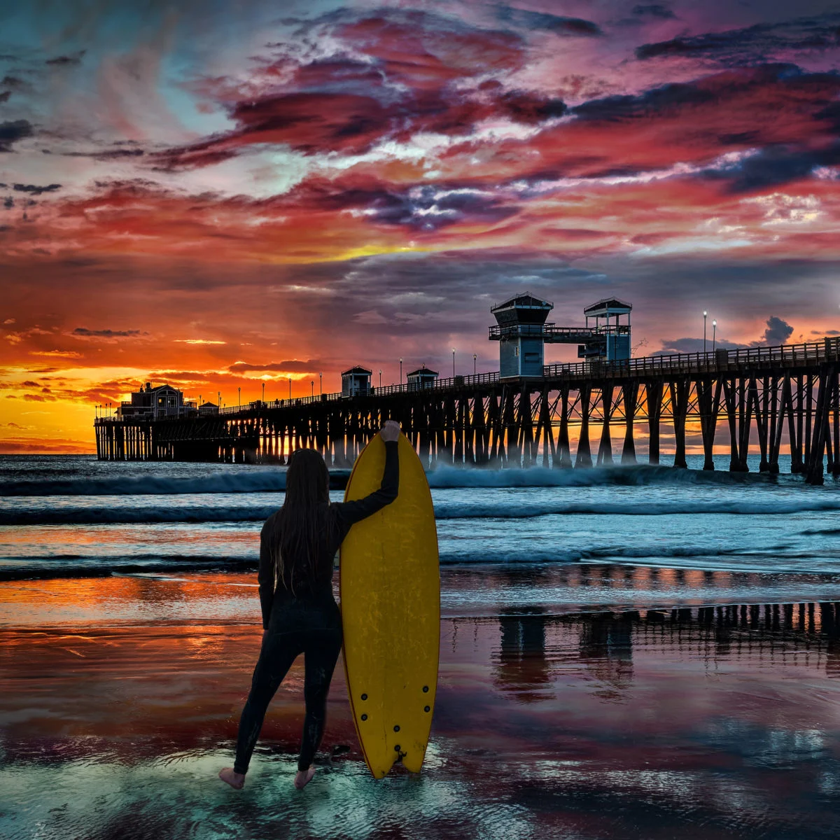 Surfer at sunset in Oceanside, CA
