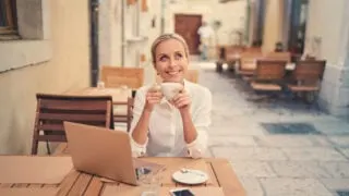 Digital nomad sipping coffee at Italian cafe