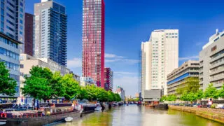 Canal running through modern skyline of Rotterdam