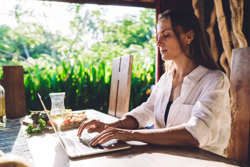 Digital Nomad Woman Working on Laptop