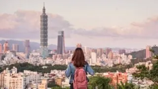 Woman looking at skyline in Taipei