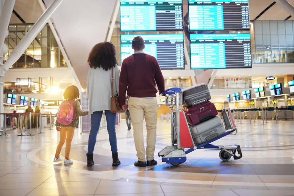 Family with luggage at airport