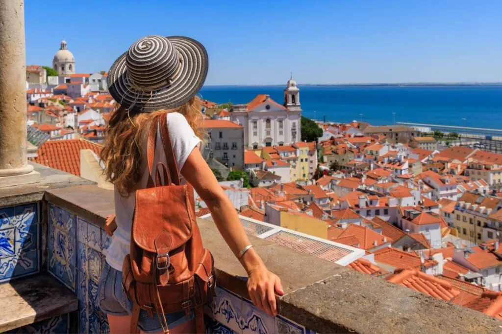 Woman overlooking the city of Lisbon