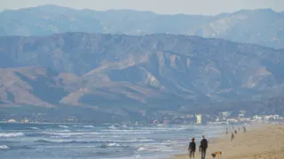 People walking on Hollywood Beach in Oxnard, CA