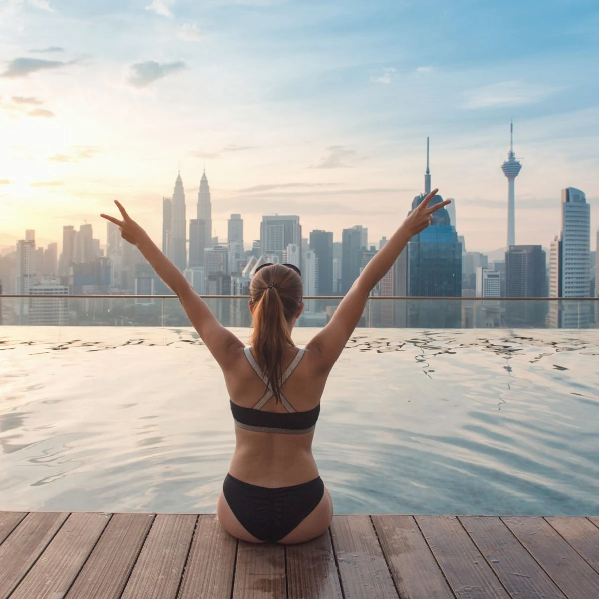 Tourist at rooftop pool in Kuala Lumpur