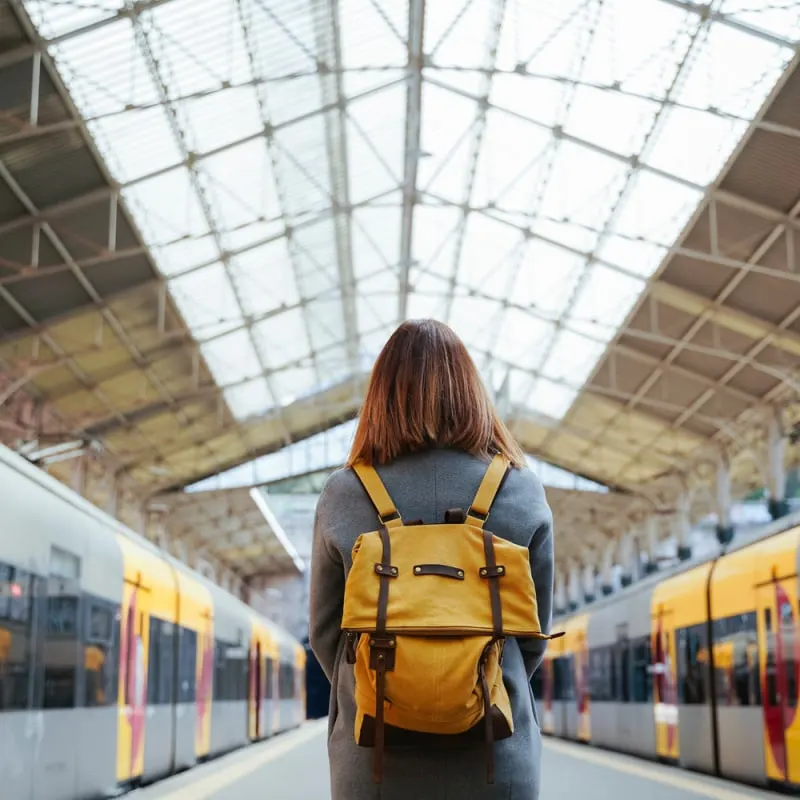 Young Woman Boarding A Train In Porto, Portugal