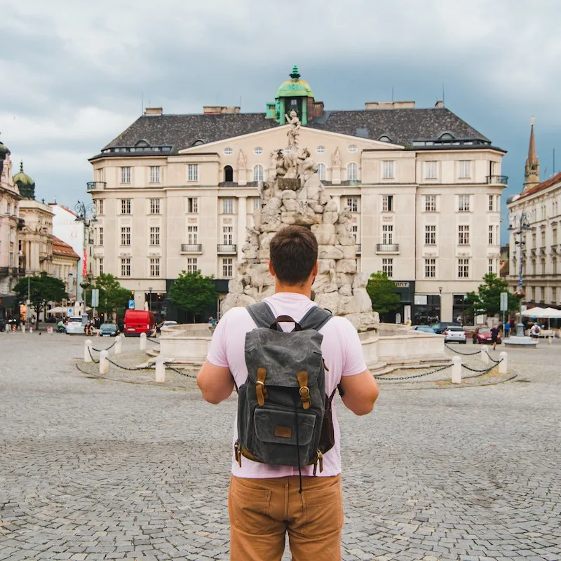 Male Traveler Standing In Center Of ublic Square In Brno, Czech Republic, Europe