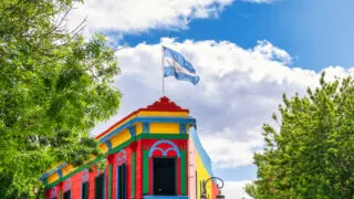 Brightly colored building with Argentina flag