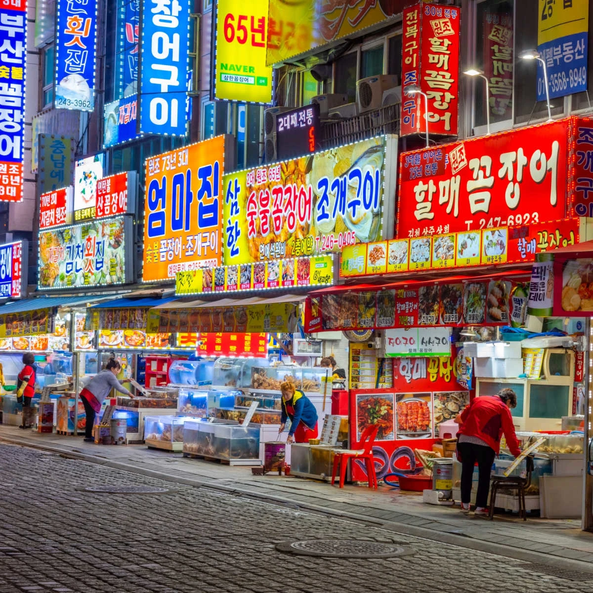 Vibrant street with neon signs in Busan, South Korea