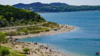 Kayakers and beachgoers at Canyon Lake, TX