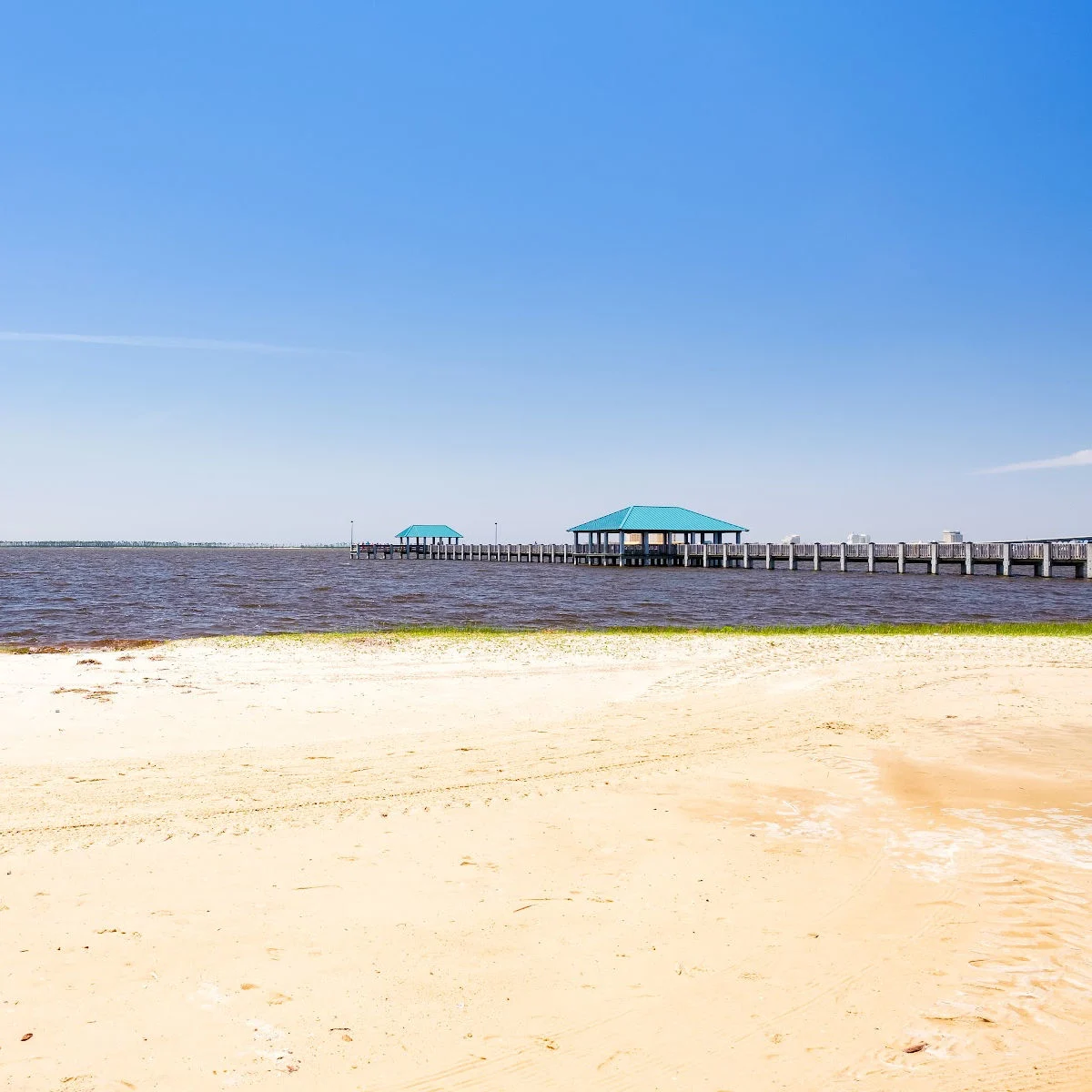 White sand beach on nice day in Ocean Springs, MS