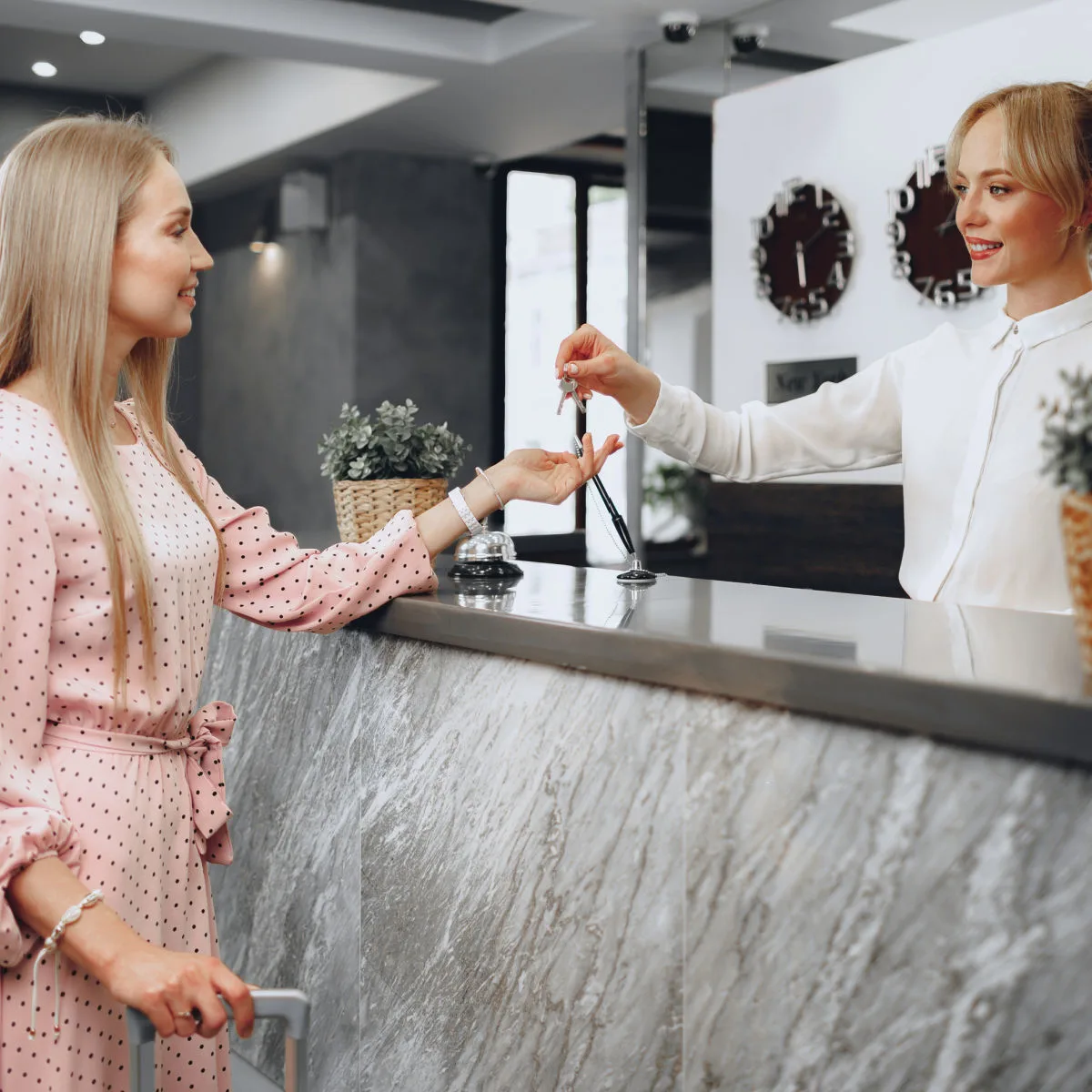 Woman checking in to hotel