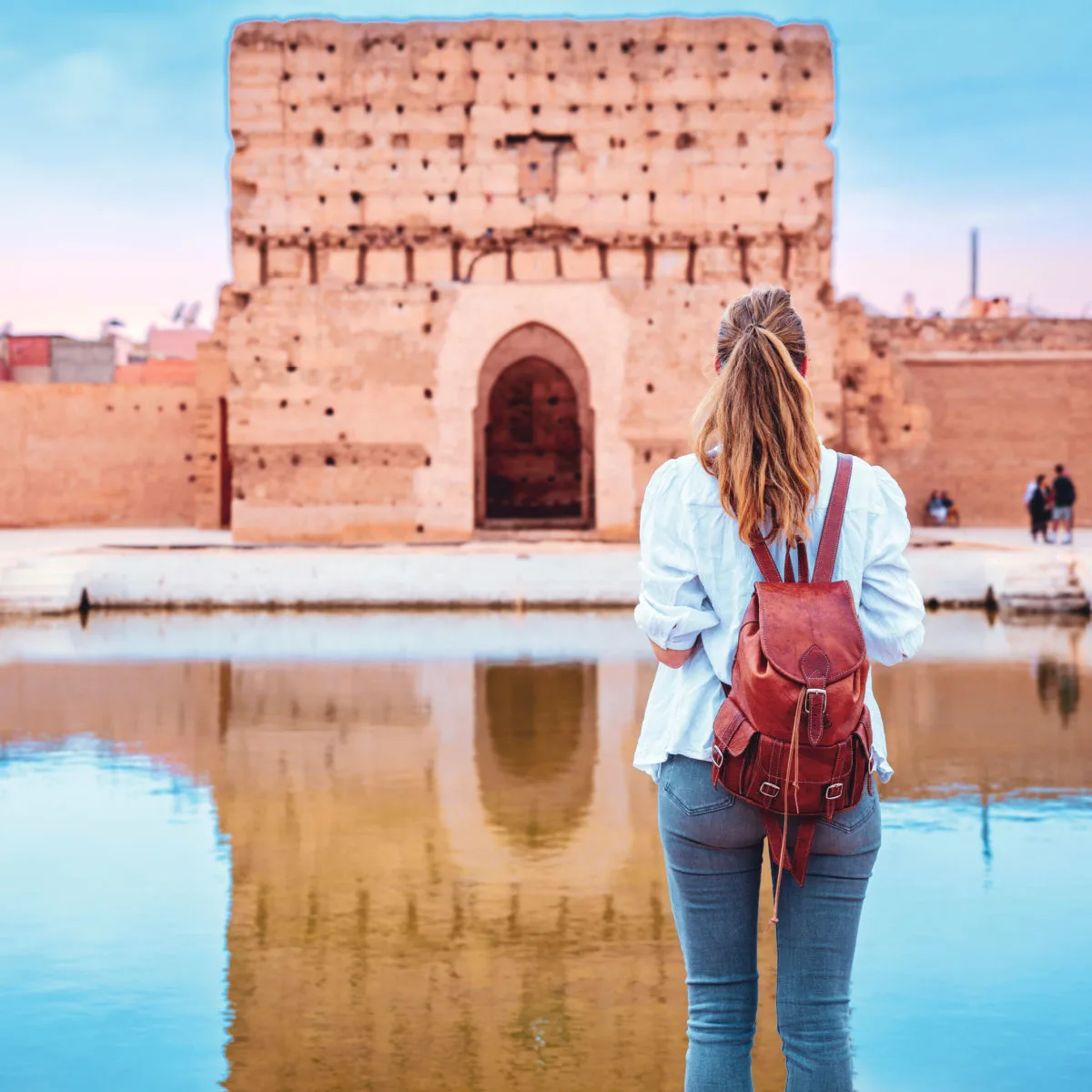 Woman visiting Badi Palace in Marrakesh