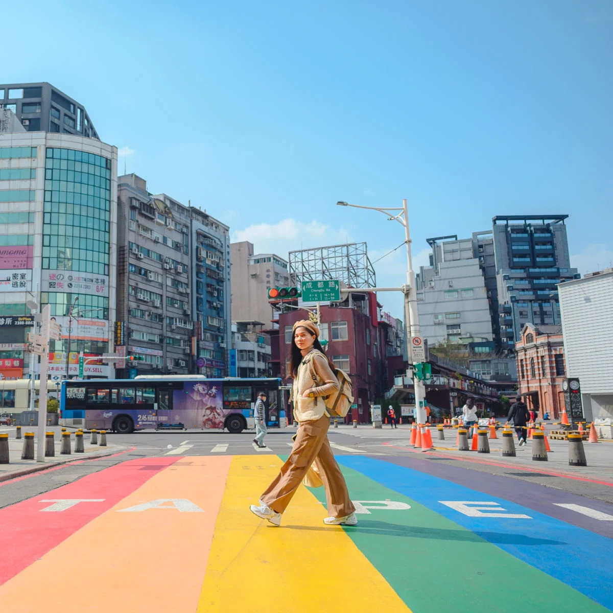 Woman walking on painted sidewalk in Taipei